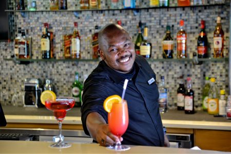 Bar tender serving drink
